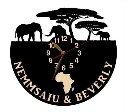Black wooden wall clock with elephant silhouettes and custom names