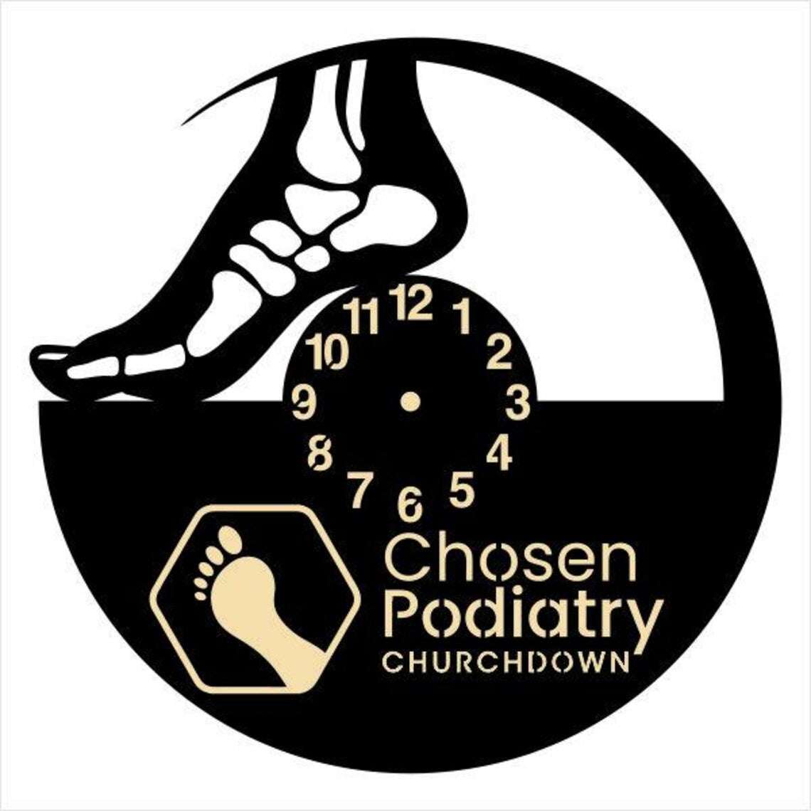 Decorative wall clock showing a foot outline and footprints, personalized with business name