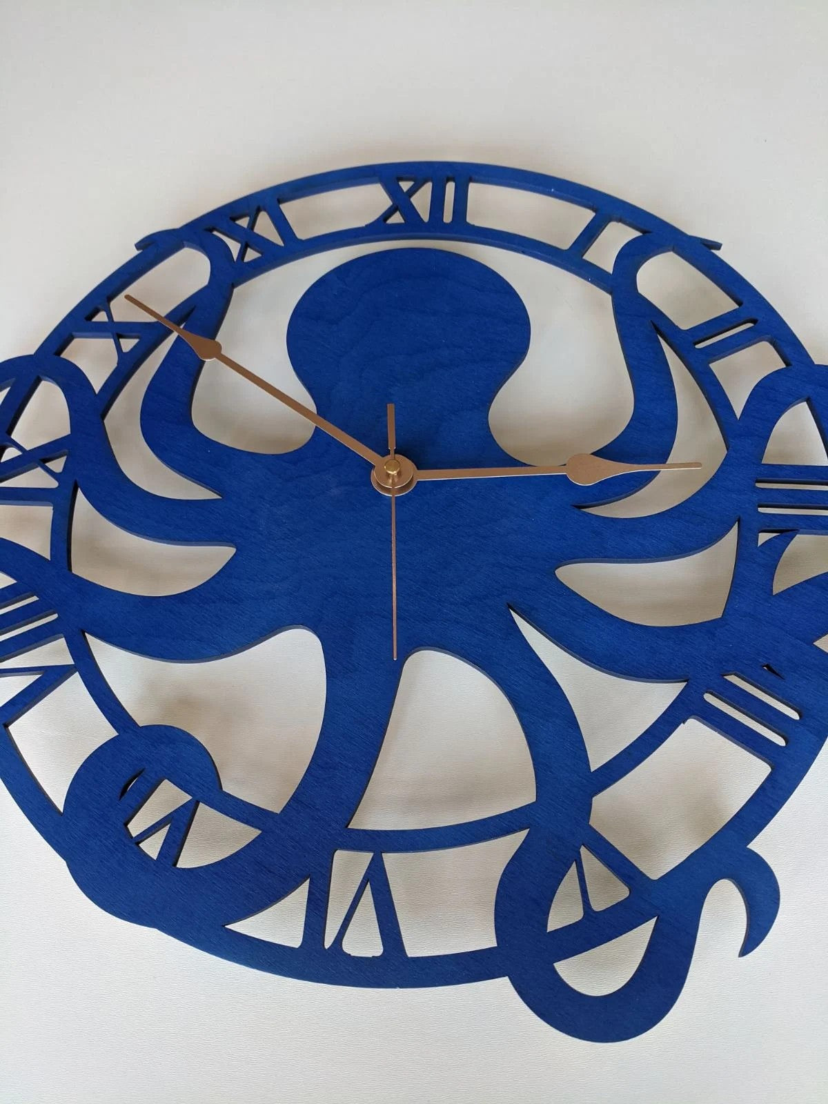 Blue nautical octopus clock hanging in modern living room