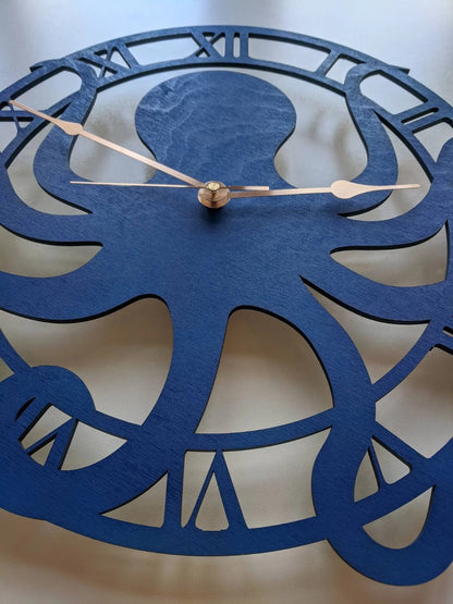 Blue octopus wall clock with Roman numerals and gold hands