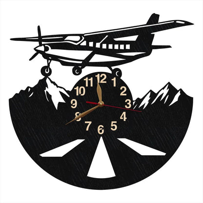 Rustic aviation wall clock with plane over snowy mountains