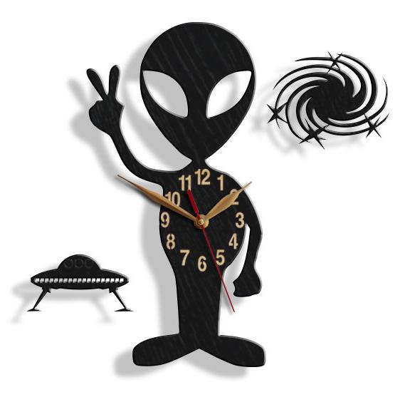 Wall clock designed like an alien giving a peace sign with UFO and galaxy swirl accents