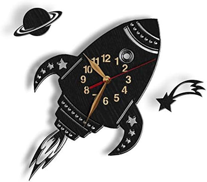 Black rocket-shaped wall clock with Saturn and comet accents
