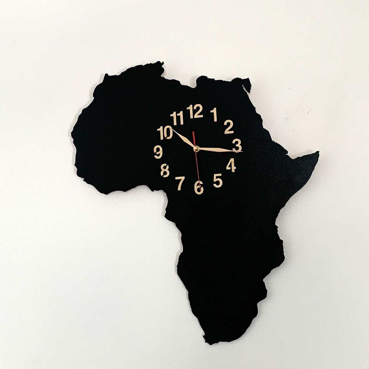 Minimalist wall decor featuring Africa map clock in modern interior
