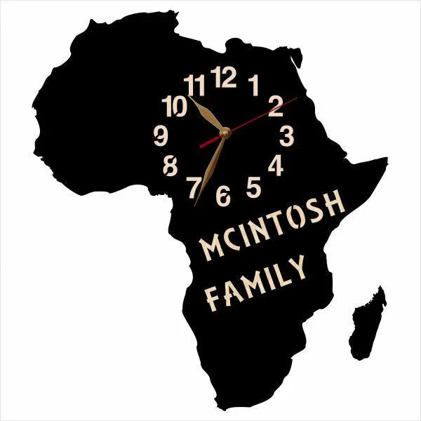 Africa-shaped wall clock with ‘McIntosh Family’ personalization on black wood