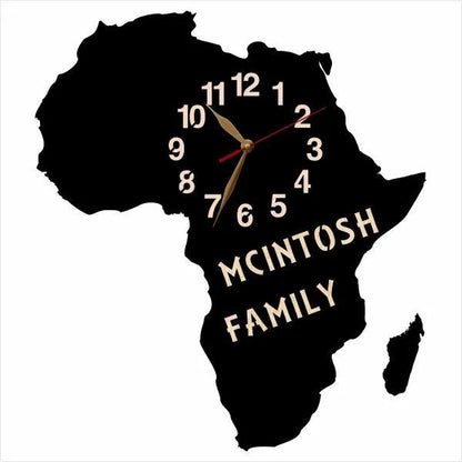 Africa-shaped wall clock with ‘McIntosh Family’ personalization on black wood