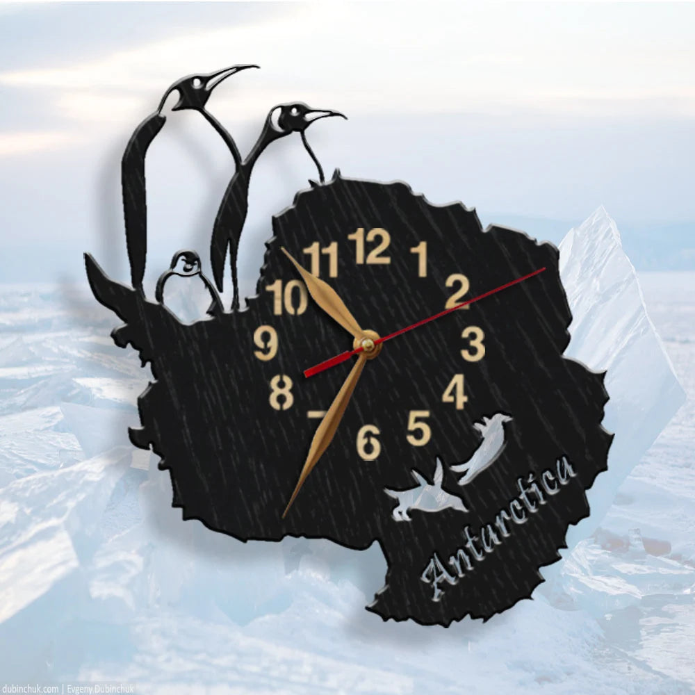 Wall clock shaped like Antarctica with penguins and the word "Antarctica"