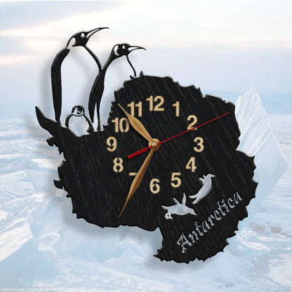 Wall clock shaped like Antarctica with penguins and the word "Antarctica"