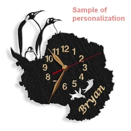 Personalized wall clock showing penguins on black map of Antarctica