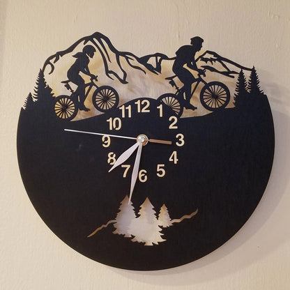 Cycling adventure wall clock with male and female riding together in the mountains