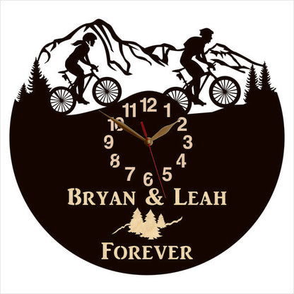 Couples’ cycling wall clock with custom text and pine tree scene