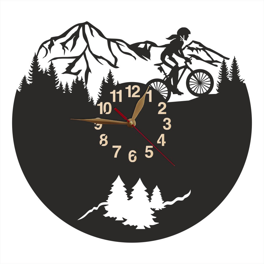 Mountain biking wall clock with female rider and pine tree background