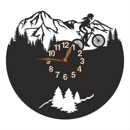 Mountain biking wall clock with female rider and pine tree background
