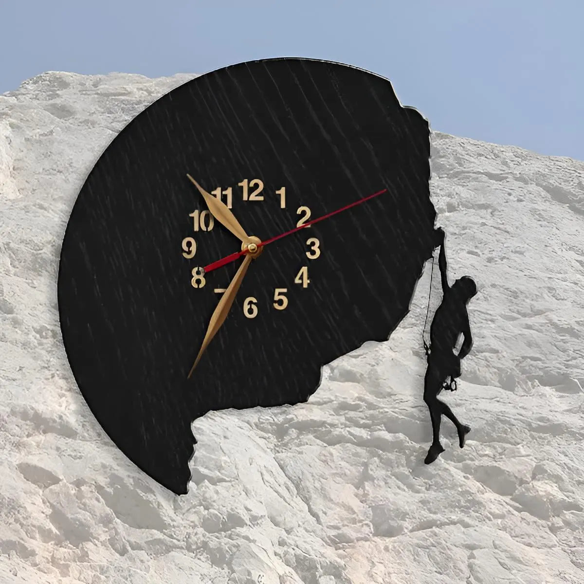 Rock climbing wall clock with a man silhouette on a rugged cliff face