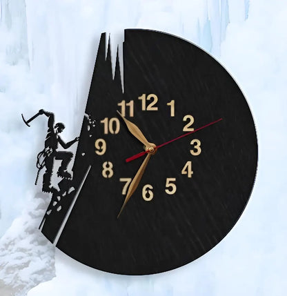 Black wooden wall clock featuring an ice climber with axe and crampons, climbing an icy mountain ridge.