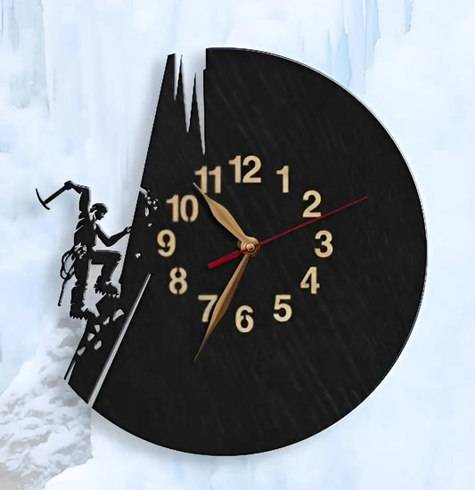 Black wooden wall clock featuring an ice climber with axe and crampons, climbing an icy mountain ridge.
