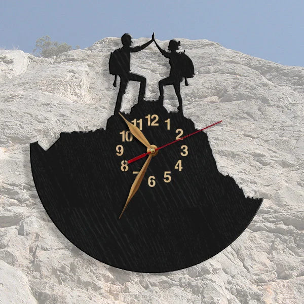 Romantic hiking couple wall clock against a rocky mountain background