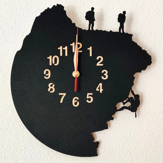 Adventure-themed wall clock showing cliff scaling scene with two hikers and a climber above
