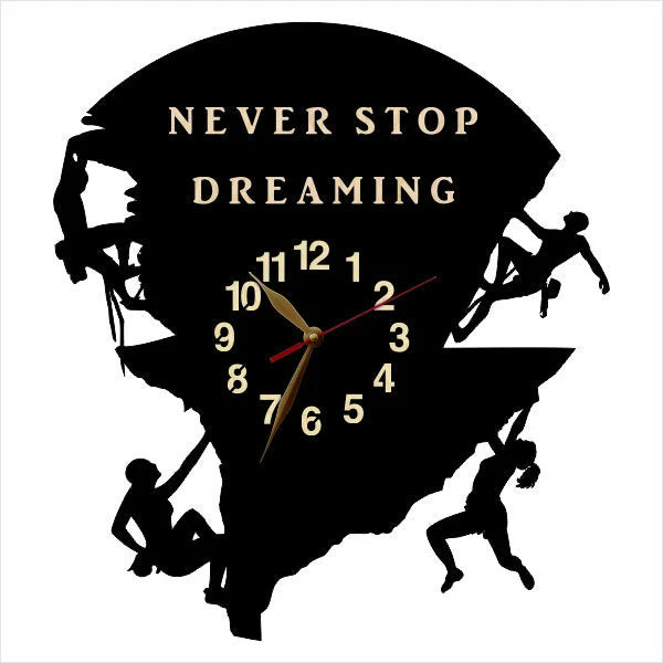 Decorative wall clock showing climbers in various ascent positions with “Never Stop Dreaming” text