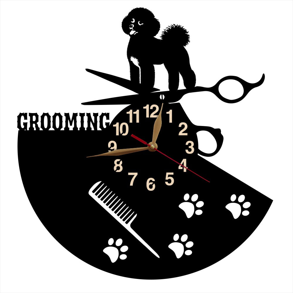Wall clock with dog grooming design featuring a bishon, scissors, and paw prints on a black background.