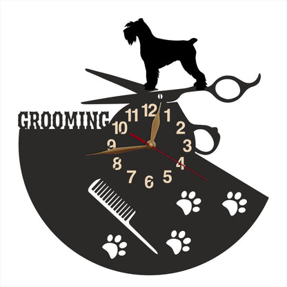 Wall clock with dog grooming theme featuring a silhouette of a schnauzer, scissors, and a comb.