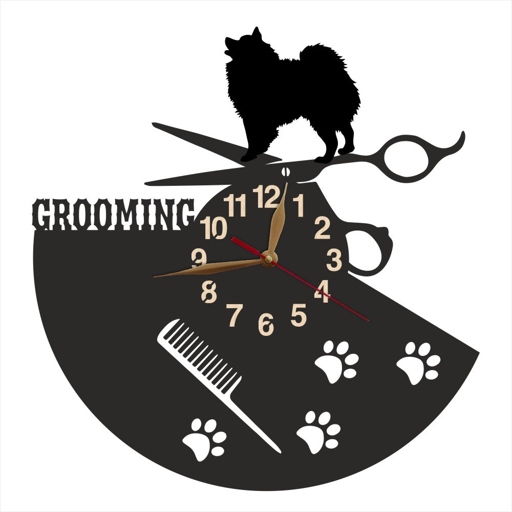 Wall clock with dog grooming design featuring a silhouette of a spitz, scissors, and a comb.