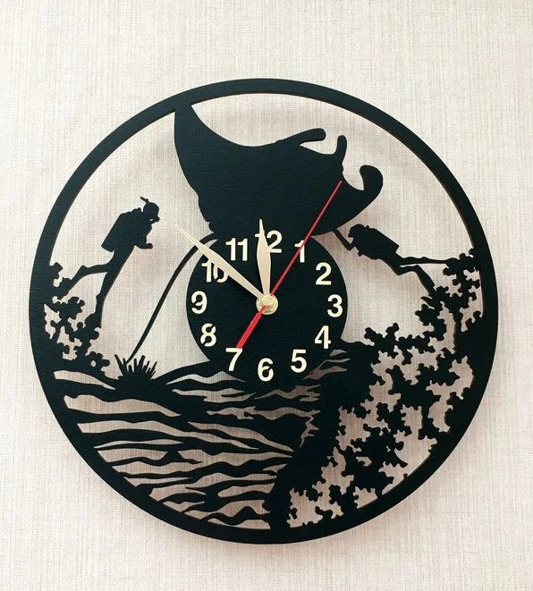 Close-up of ocean-themed wooden clock with reef and divers silhouette