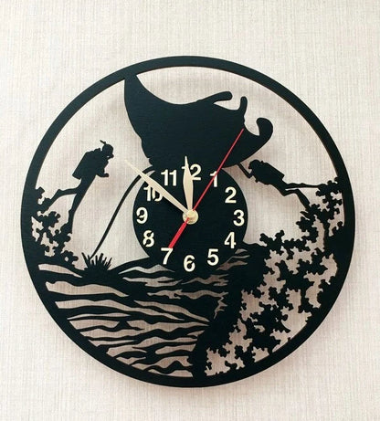 Close-up of ocean-themed wooden clock with reef and divers silhouette