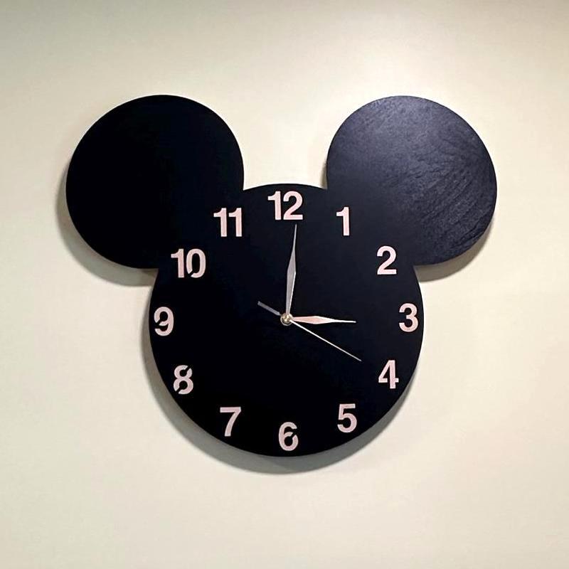 Playroom wall featuring black mouse-ear clock