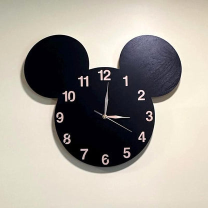 Playroom wall featuring black mouse-ear clock