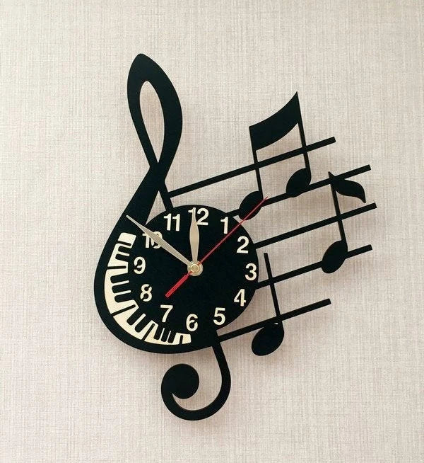 Treble clef wall clock with piano keys and notes – mounted on wall