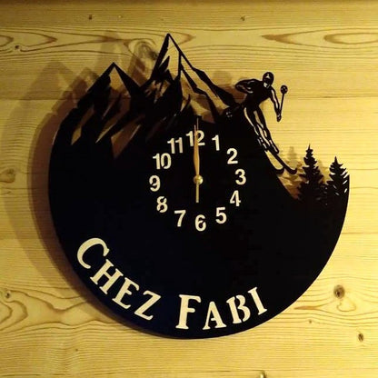 Personalized wall clock with freestyle skier silhouette on a mountain
