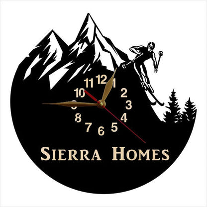 Personalized skier wall clock with mountain peaks and custom inscription