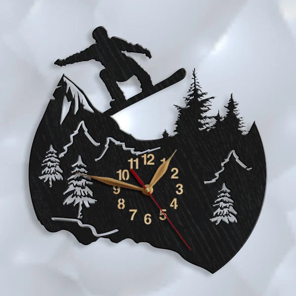 Black wall clock with snowboarder silhouette, snowy mountains
