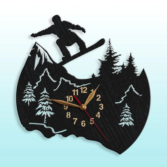 Wall clock featuring a flying snowboarder in mid-air against forest and snow-covered mountains