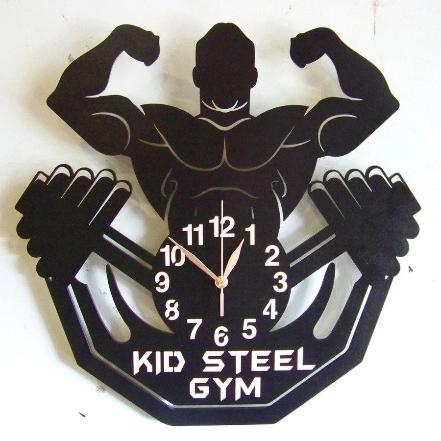 Gym-themed clock featuring male flexing silhouette and custom name option