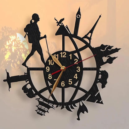 Wall clock with female backpacker silhouette walking over globe and world landmarks