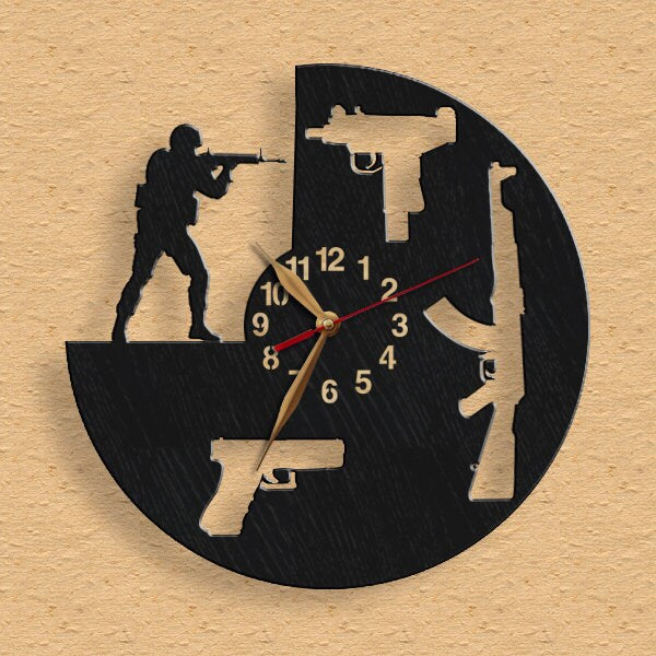 wall clock featuring rifle, pistol, submachine gun shapes