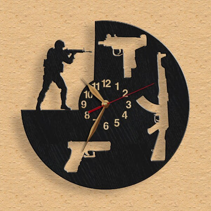 wall clock featuring rifle, pistol, submachine gun shapes