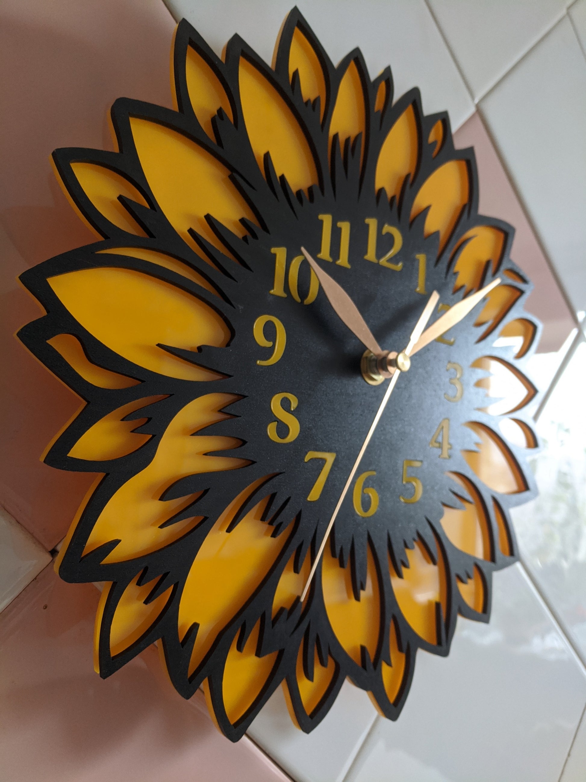 Side angle view of sunflower wall clock showing depth and design