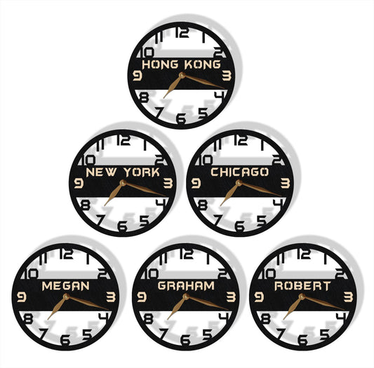 A collection of personalized wall clocks showing different time zones with black and white faces, some with custom names like 'Hong Kong', 'New York', 'Chicago', 'Megan', 'Graham', and 'Robert'.