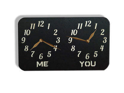 A personalized dual-time wall clock. The labeles 'ME' and 'YOU' is customized and can be changed to custom inscriptions