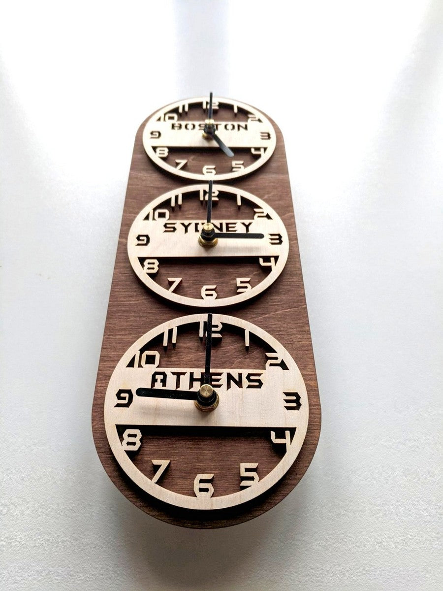 Laser-cut world time wall clocks with engraved city names