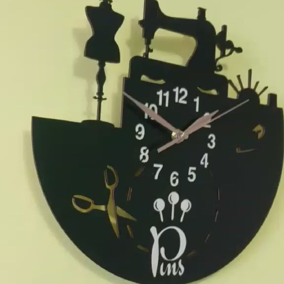 Video showing a handmade wall clock for sewing salons featuring a sewing machine, scissors, and thread spools design