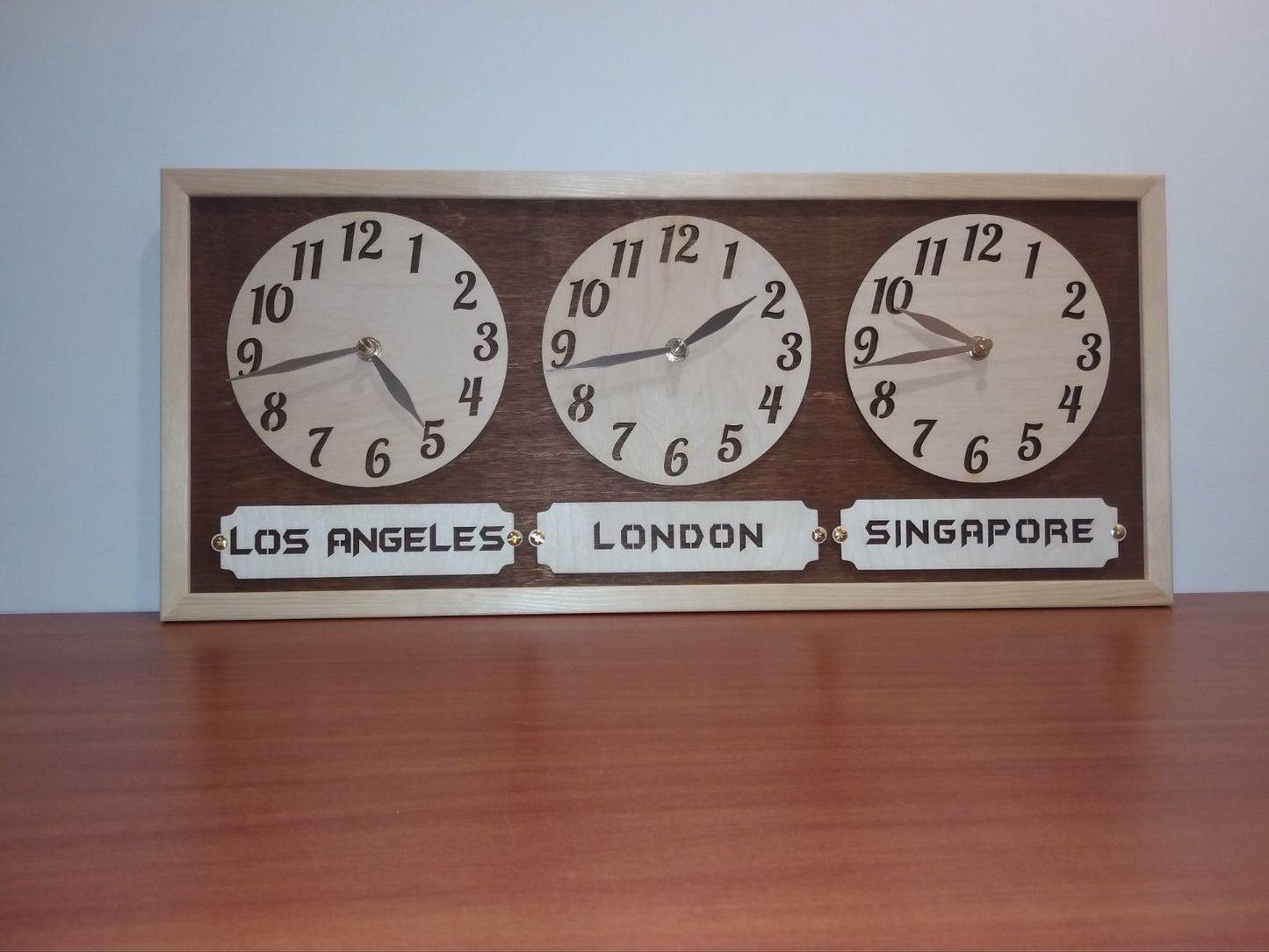 Custom multi-clock wall decor showing different global times for home or workspace.