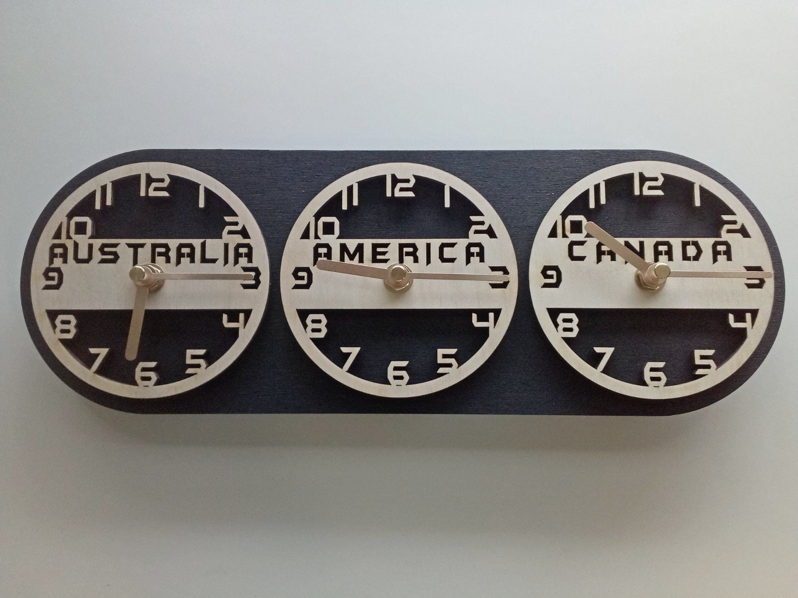 Set of custom countries names wall clocks designed to show different local times