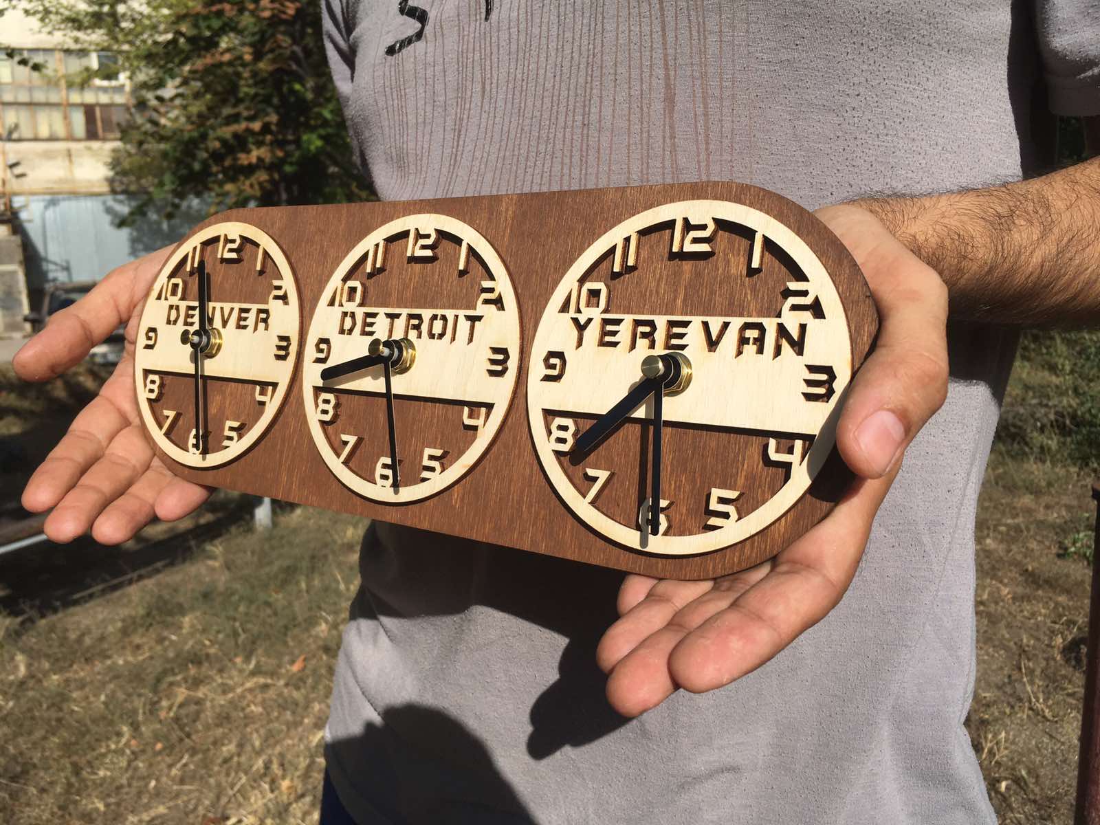Natural wood wall clocks engraved with city names for global office decor